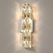 Modern chrome crystal wall light featuring a vertical stack of faceted crystals for luxury living room decorbites sconce