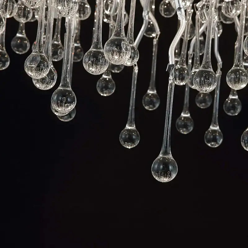Modern chrome crystal water drop branch chandelier with clear glass teardrop elements and subtle internal ridges