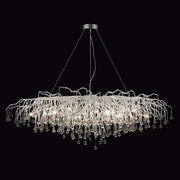 Modern chrome crystal water drop branch chandelier with a circular mount and cascading glass arms for living room light