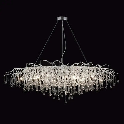 Modern chrome crystal water drop branch chandelier with a circular mount and cascading glass arms for living room light