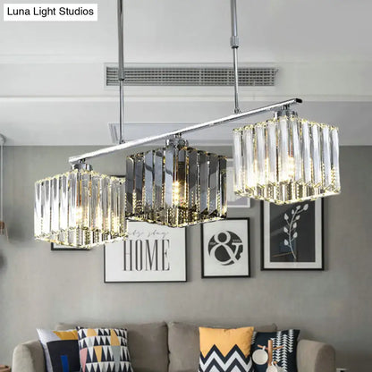 Modern chrome cube island ceiling light with three cascading crystal prisms and warm-toned led ceiling light for dining room