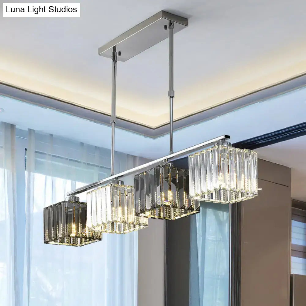 Modern chrome cube island ceiling light with three cascading crystal prisms suspended by polished rods for dining room
