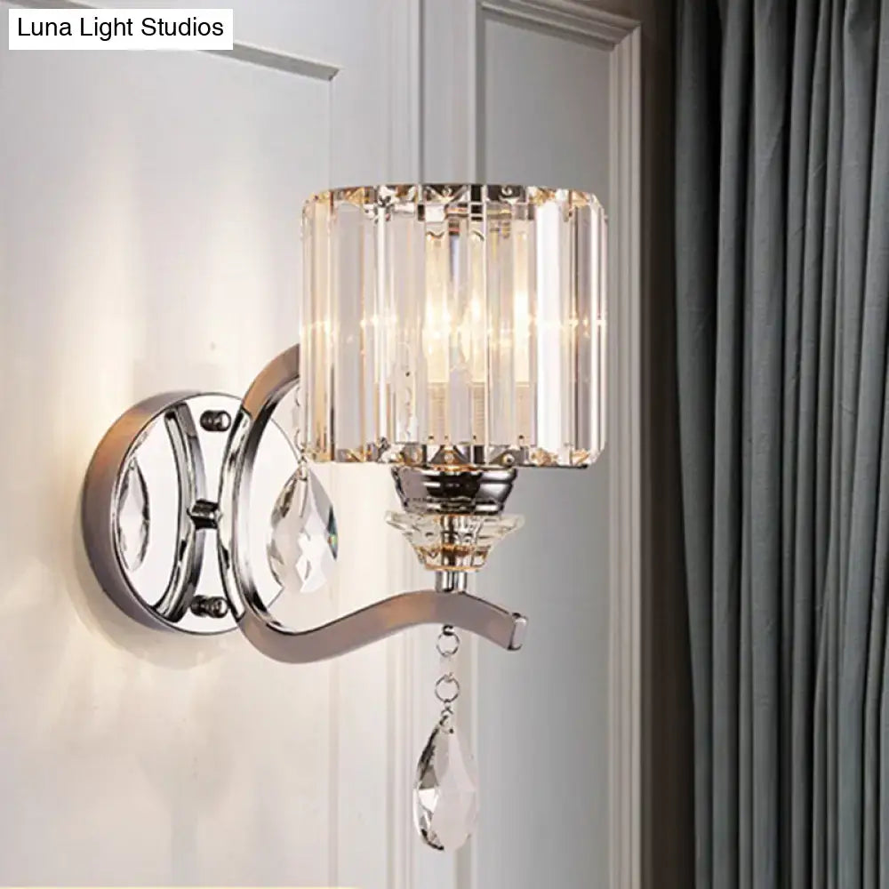 Modern crystal block cylinder wall light with crystal-encrusted chrome base and teardrop pendant for bedroom use
