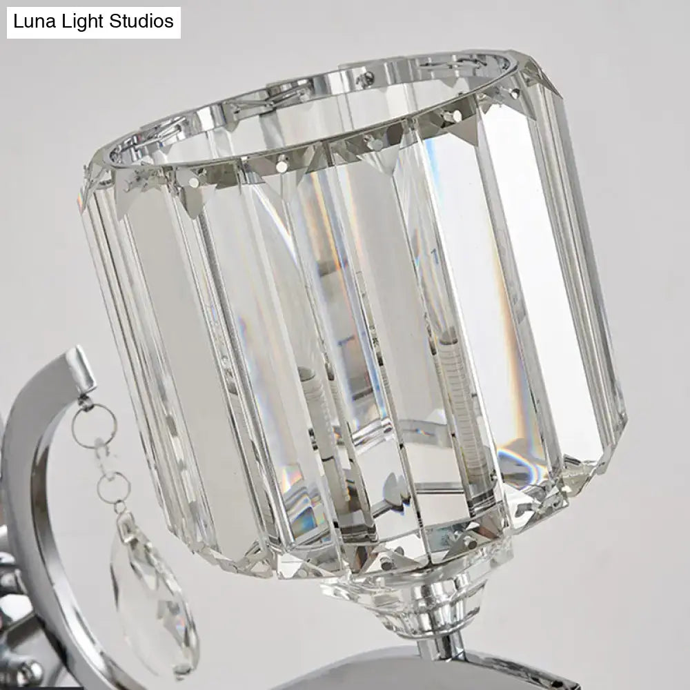 Modern crystal block cylinder wall light with faceted crystal shade and polished chrome finish for bedroom sconce
