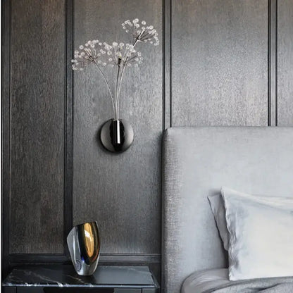 Modern chrome dandelion crystal flower wall lamp with black wall-mounted vase holding delicate white flowers decorbites dandelion crystal