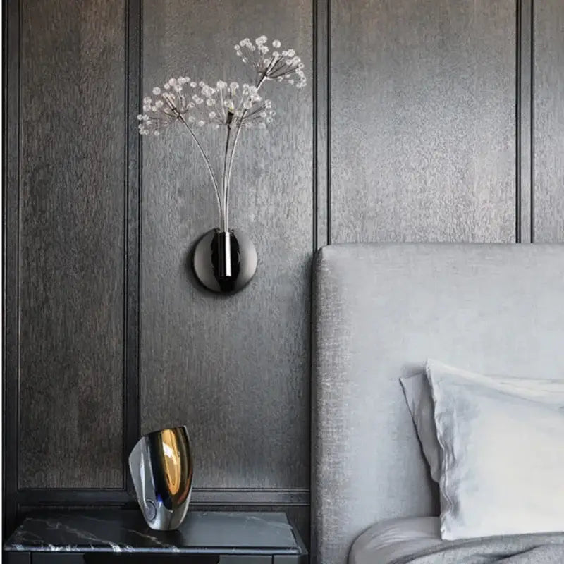 Modern chrome dandelion crystal flower wall lamp with black wall-mounted vase holding delicate white flowers decorbites dandelion crystal