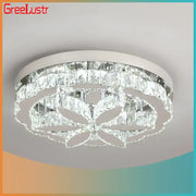 A modern chrome decorbites crystal ceiling chandelier with clear rectangular prisms in an elegant floral pattern