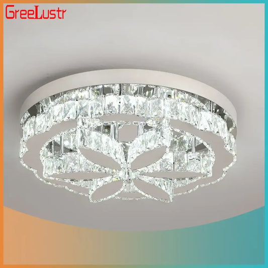 A modern chrome decorbites crystal ceiling chandelier with clear rectangular prisms in an elegant floral pattern