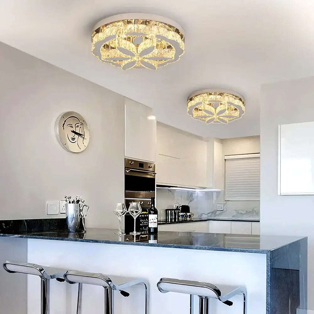 Modern chrome decorbites crystal ceiling chandelier with gold-toned frames and leaf designs emitting warm light