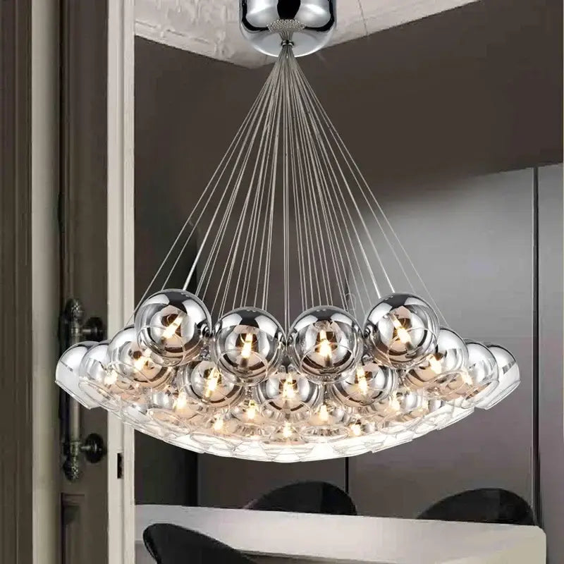 Modern chrome decorbites pendant light with multiple crystal glass ball bulbs suspended by thin cables for living room