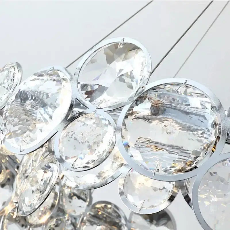 A cluster of clear faceted crystal pendants with polished silver frames for modern chrome decorbites crystal led chandelier