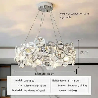 A modern chrome decorbites crystal led chandelier with clear faceted crystal discs for dining room lighting