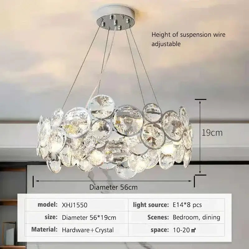 A modern chrome decorbites crystal led chandelier with clear faceted crystal discs for dining room lighting