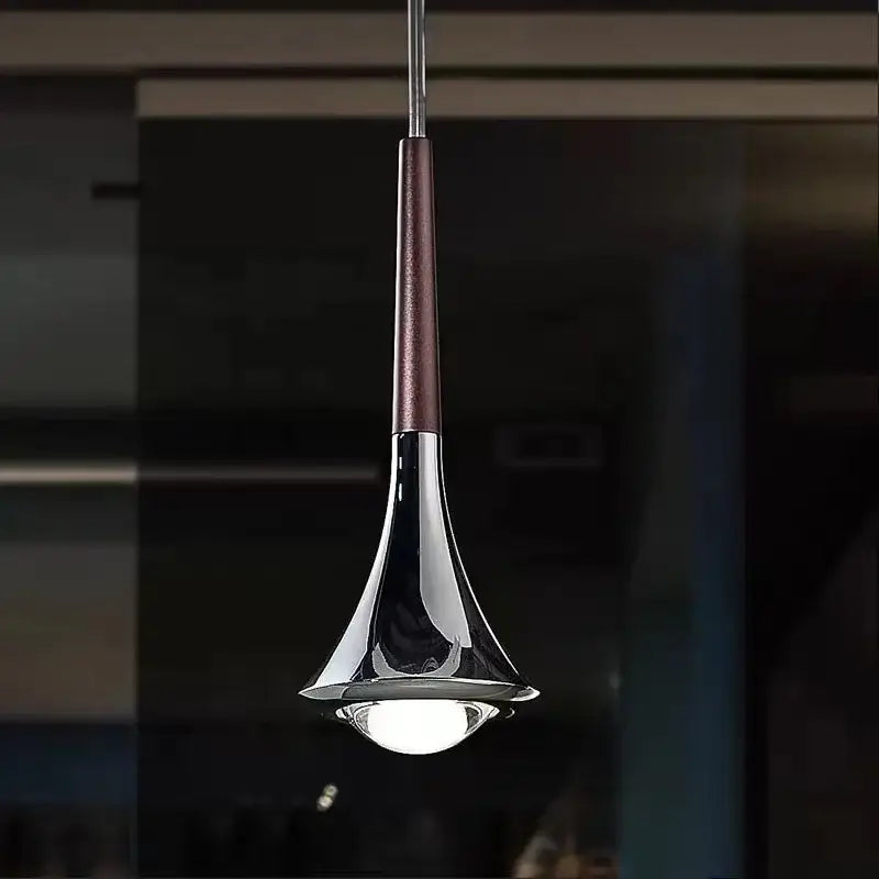 Modern chrome decorbites led studio pendant light with sleek trumpet shape and dark brown textured accent for staircase bar use