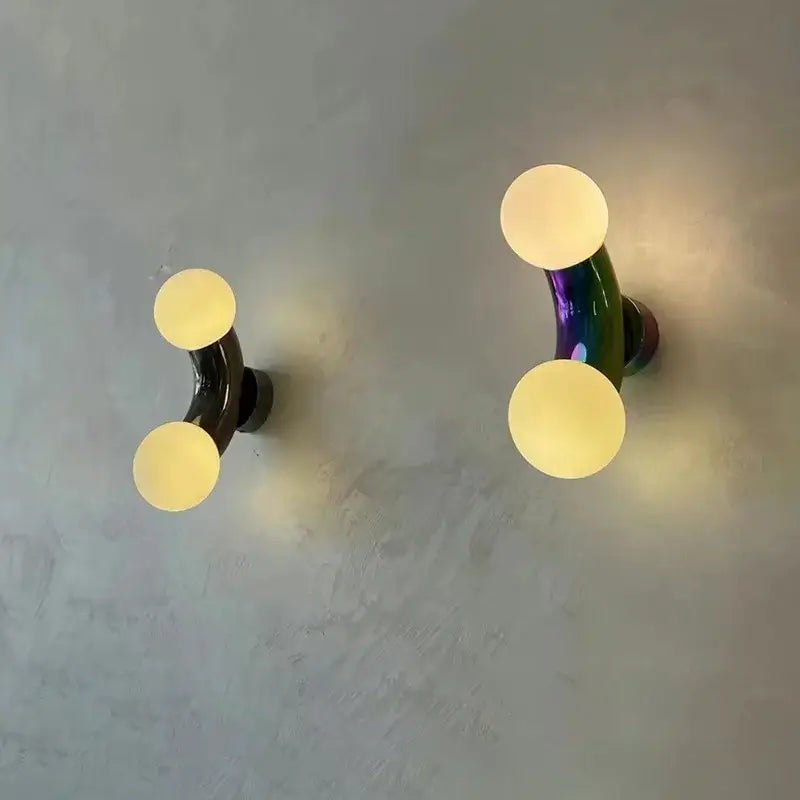 Modern chrome decorbites designer grape wall sconce with glossy black and iridescent curved glass stems for bedroom lighting
