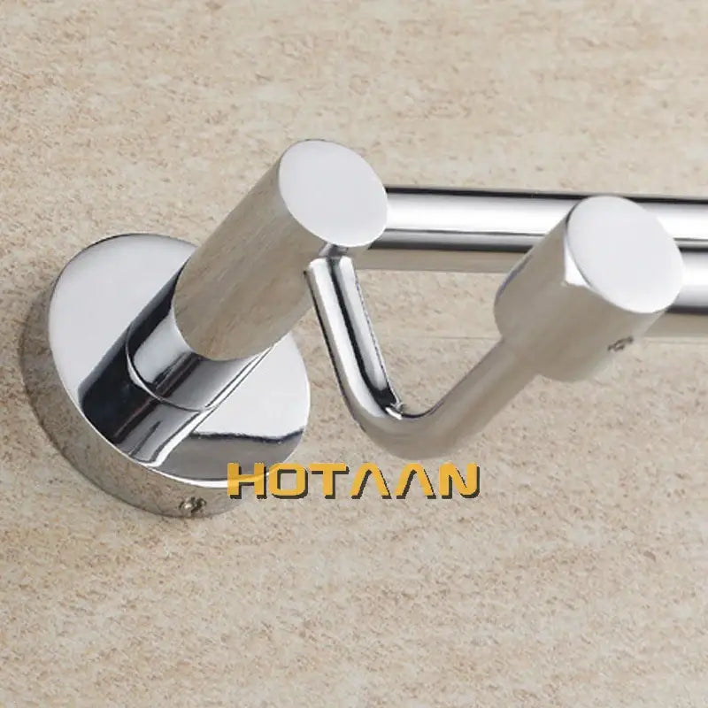 Modern chrome double towel bar with wooden-textured cylindrical handles for bathroom use