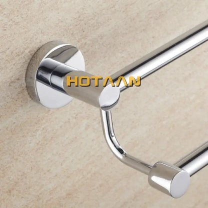 Modern chrome double towel bar with sleek polished metal bars and circular wall-mounted base for bathroom use
