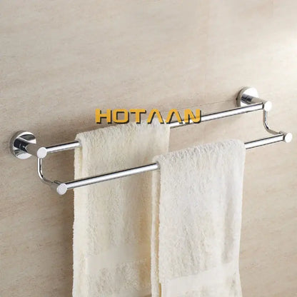Modern chrome double towel bar bathroom rack with two parallel bars and circular wall mounts holding white towels