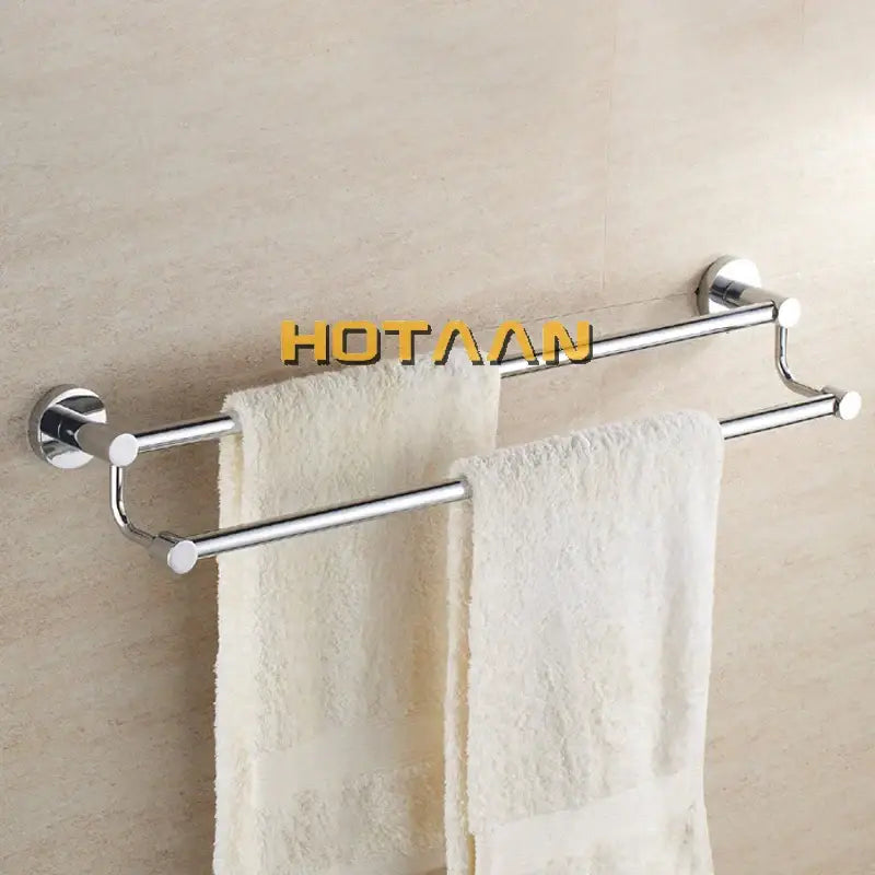 Modern chrome double towel bar bathroom rack with two parallel bars and circular wall mounts holding white towels