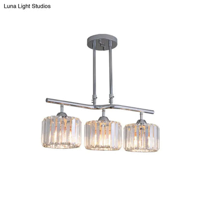 Decorbites modern chrome pendant light with three cylindrical crystal shades featuring vertical faceted cuts for dining room island