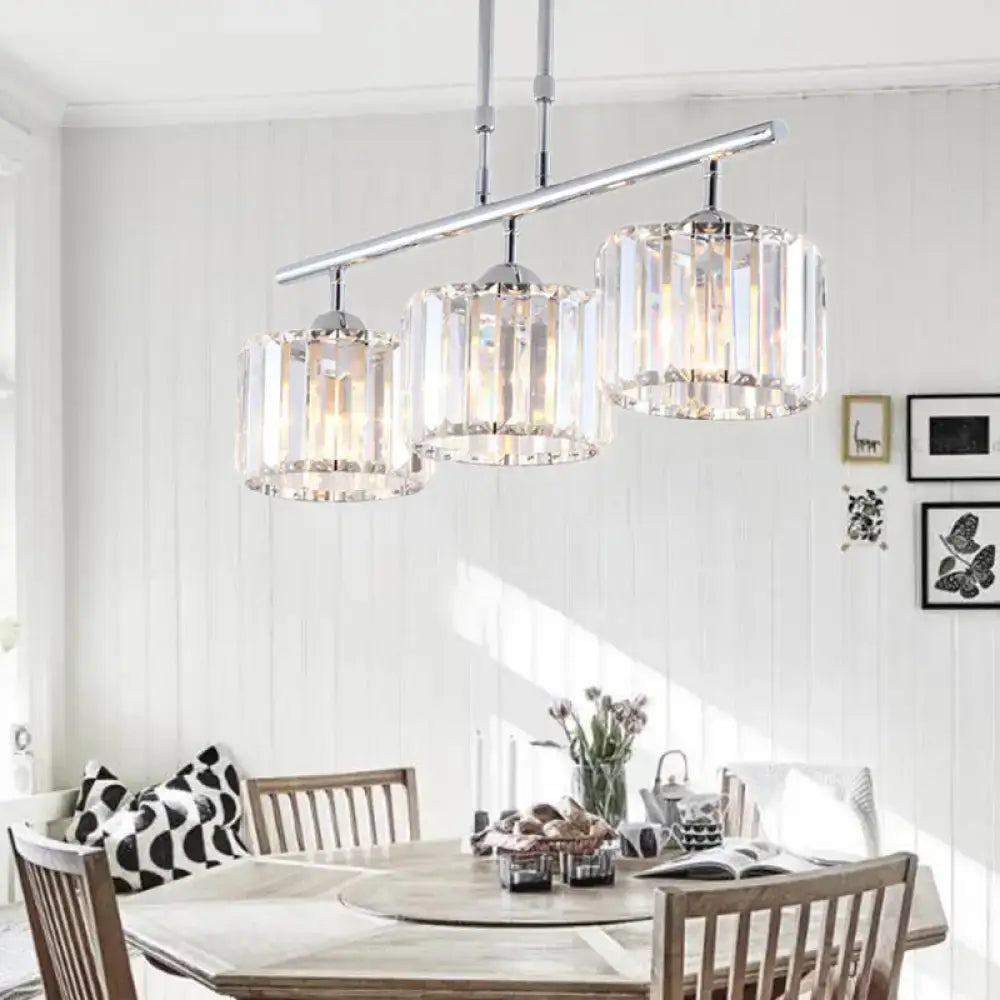 Modern chrome drum pendant light with three cylindrical crystal shades ideal for bedroom lighting