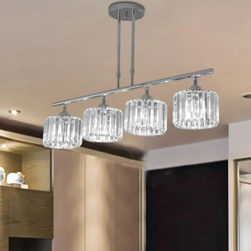 Modern chrome drum pendant light with four clear faceted crystal shades for bedroom use