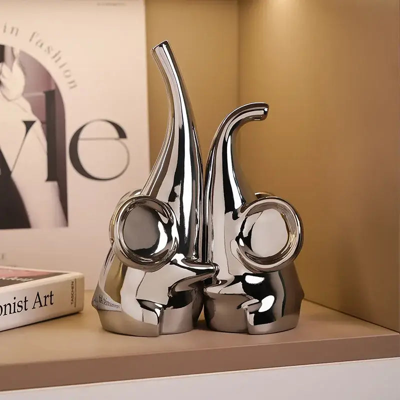 Modern chrome elephant sculpture ceramic bookends with shiny chrome finish and sleek design for living room decorbites elephant decor