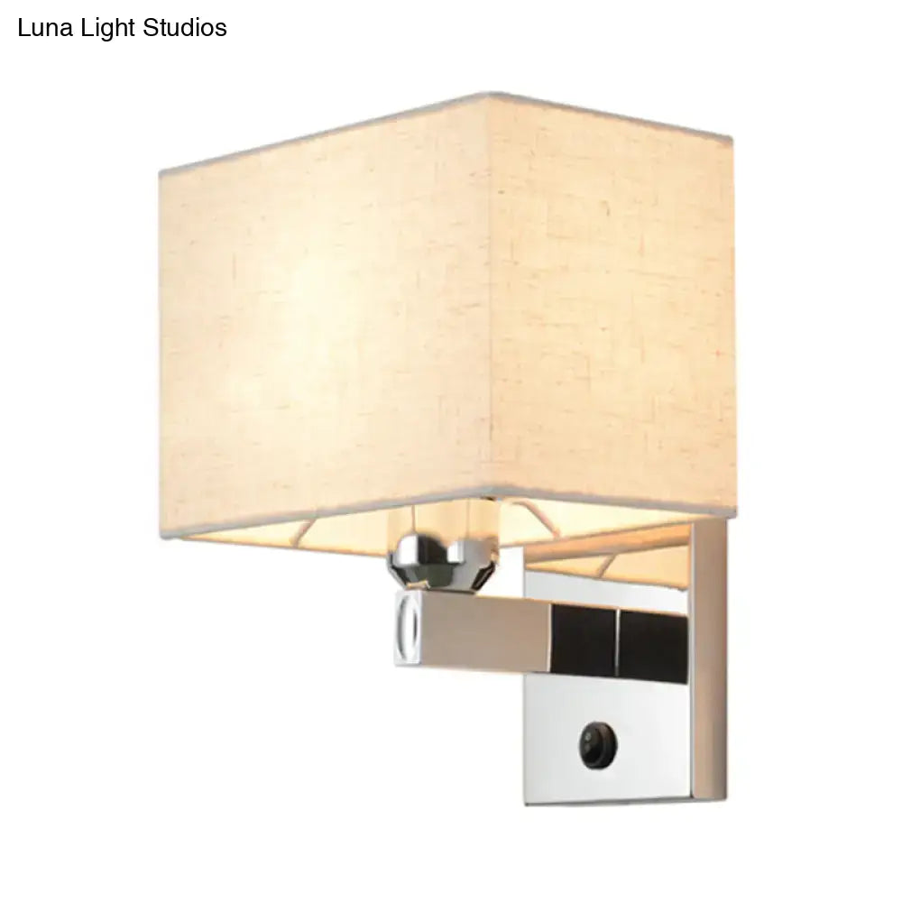 Modern chrome fabric led wall sconce with beige linen shade and polished metal frame for bedroom lighting