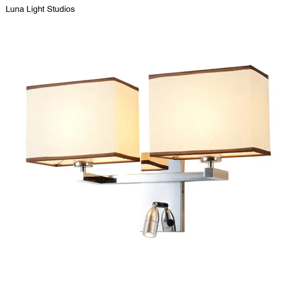 Modern chrome fabric led wall sconce with two beige shades and central adjustable spotlight direct wired electric lighting fixture
