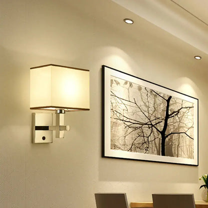 Modern chrome fabric led wall sconce with cream shade and brushed metal frame direct wired electric lighting fixture inches width