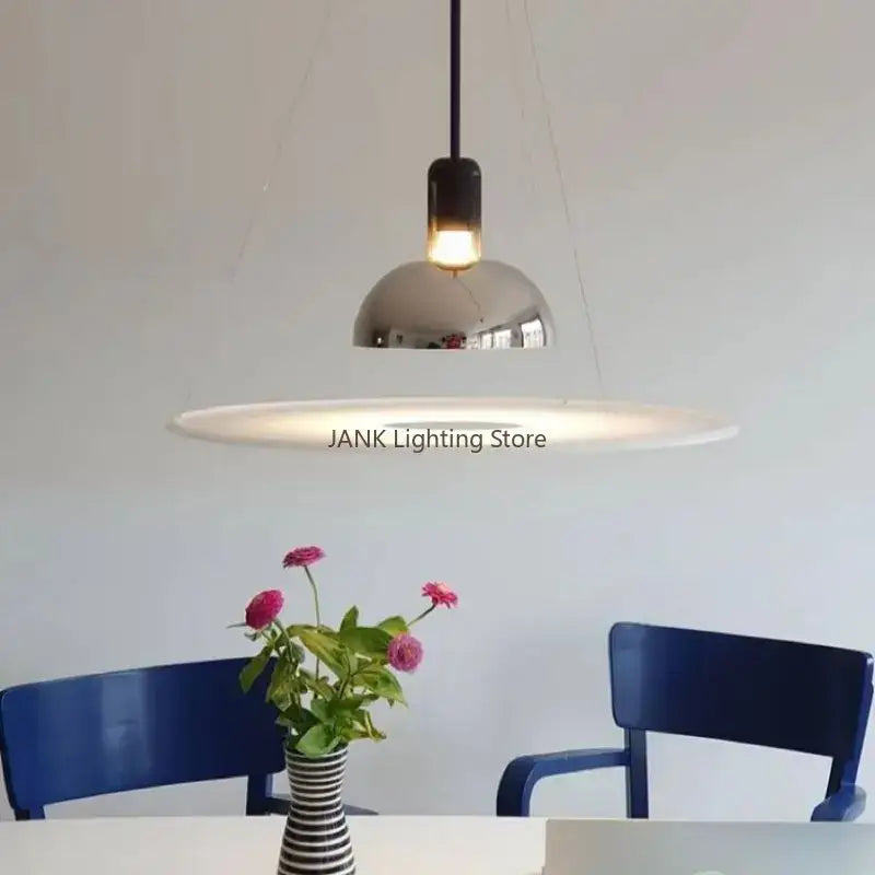 Modern chrome flying saucer chandelier with sleek dome-shaped shade and minimalist design for living room lighting
