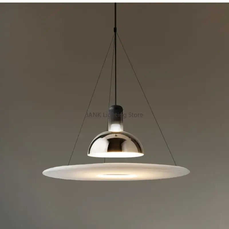 Modern chrome flying saucer chandelier with a sleek dome and wide frosted glass diffuser for living room lighting