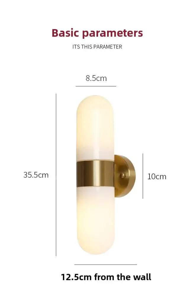 Modern chrome vanity mirror light with frosted glass body and brass accent band for bathroom wall sconce