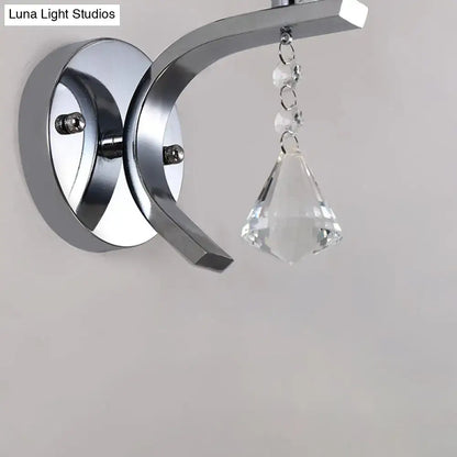 Modern chrome frosted glass wall light fixture with sleek curved arm and crystal pendant for bedroom lighting