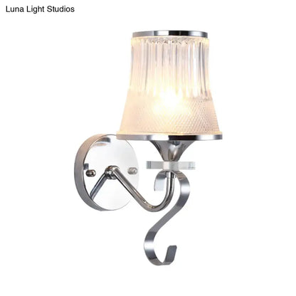 A sleek modern chrome wall light fixture with a ribbed frosted glass shade for LED incandescent fluorescent bulbs