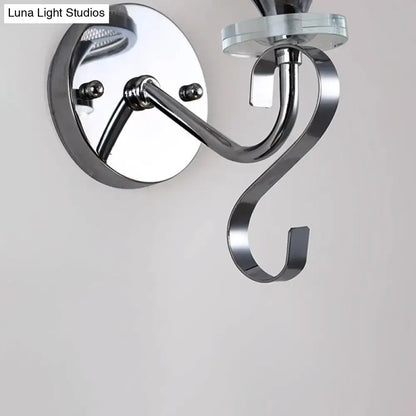 Modern chrome frosted glass wall light fixture with sleek curved arm and glass accent for bedroom lighting needs