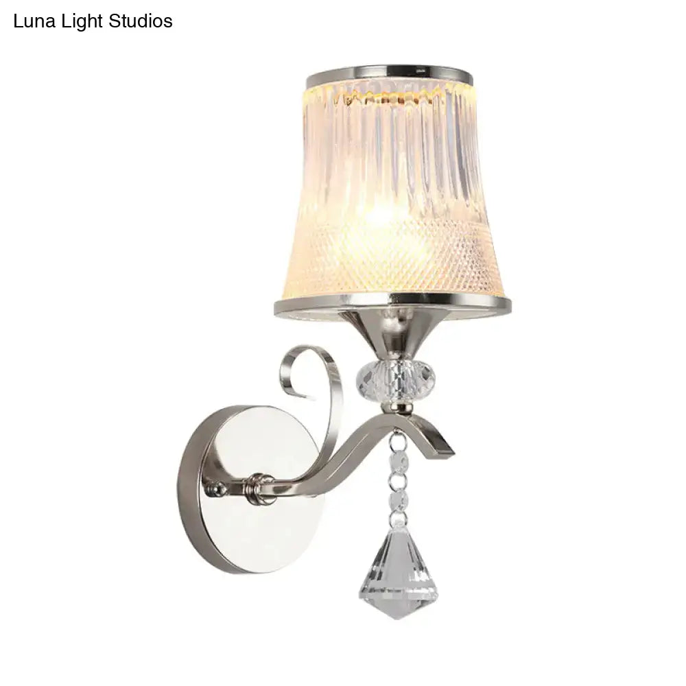 Silver-finished modern chrome wall light fixture with ribbed frosted glass shade and crystal pendant for bedroom lighting