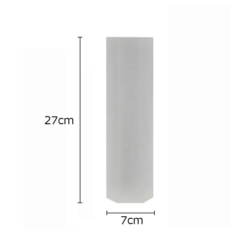 A translucent gray cylindrical vase 27cm tall 7cm wide complements modern chrome geometric crystal artwork polyhedron decorbites