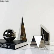 Modern chrome geometric crystal artwork polyhedron bookends with shiny reflective surfaces for living room decorbites geometric crystal decor