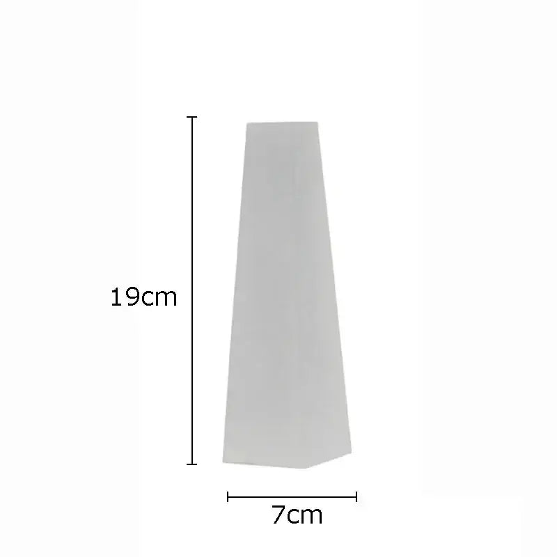 A sleek matte white tapered planter 19cm high by 7cm wide complements decorbites geometric crystal artwork polyhedron bookends