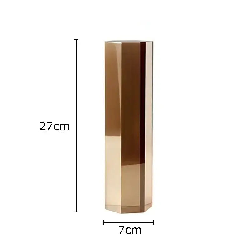 A sleek 27cm tall gold hexagonal vase with polished facets as decorbites geometric crystal artwork polyhedron decor