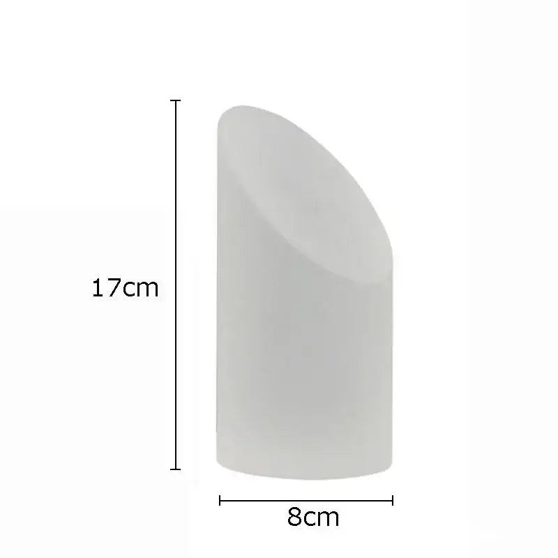 A sleek matte white cylindrical candle 17cm by 8cm complements decorbites geometric crystal artwork polyhedron bookends