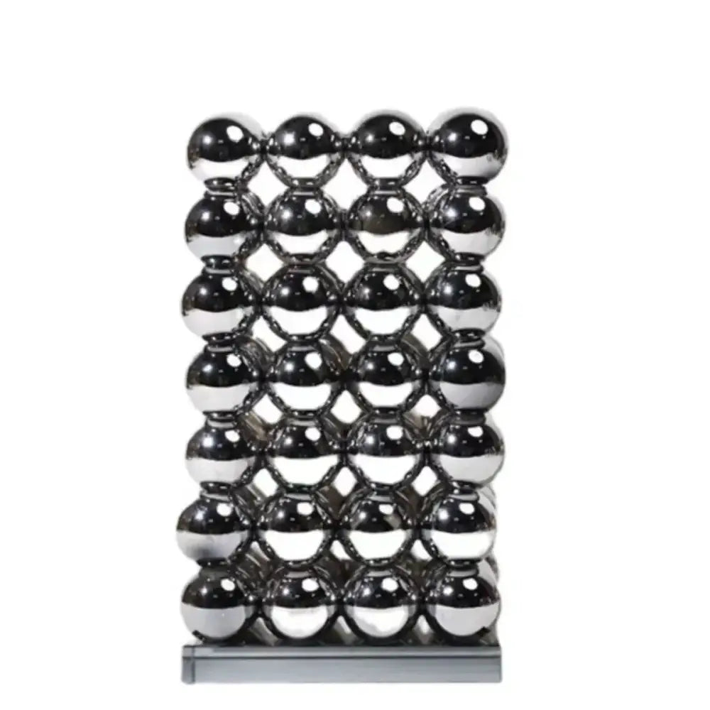 A sleek rectangular magnetic sculpture of polished chrome spheres as modern geometric crystal ball living room decor