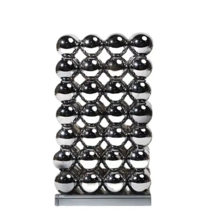 A sleek rectangular magnetic sculpture of polished chrome spheres as modern geometric crystal ball living room decor