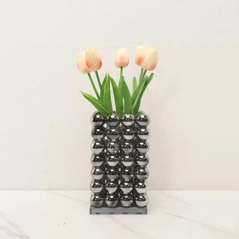 A modern chrome geometric crystal ball glass vase made of reflective spheres for living room decor