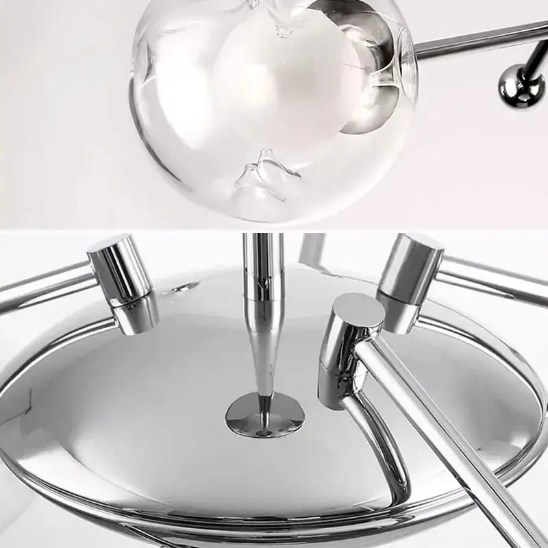 Modern chrome glass ball led chandelier features a spherical chrome lamp with polished metallic base and slender rods for decorbites glass ball led decor