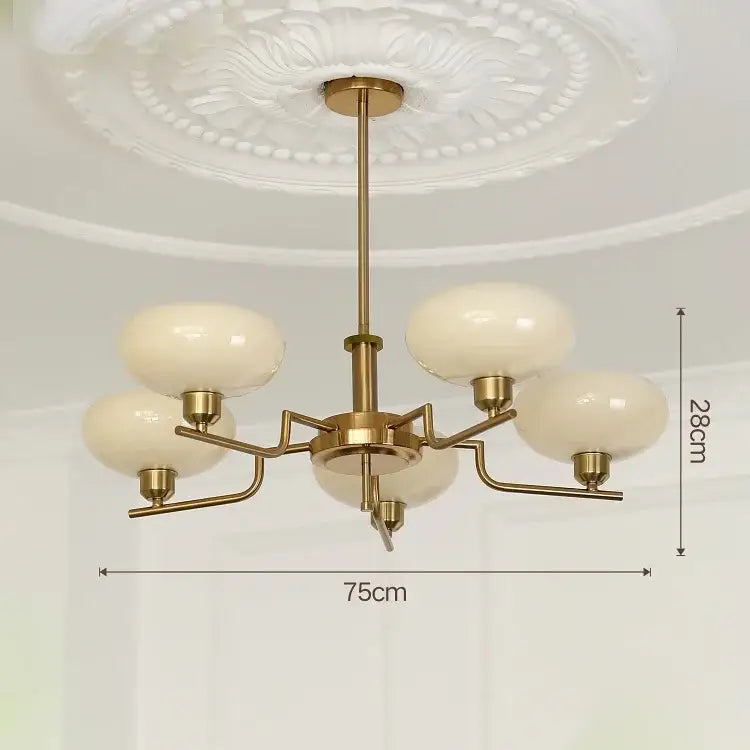Brass-finished modern chrome glass ball pendant chandelier with five cream-colored globes for bedroom decorbites glass ball