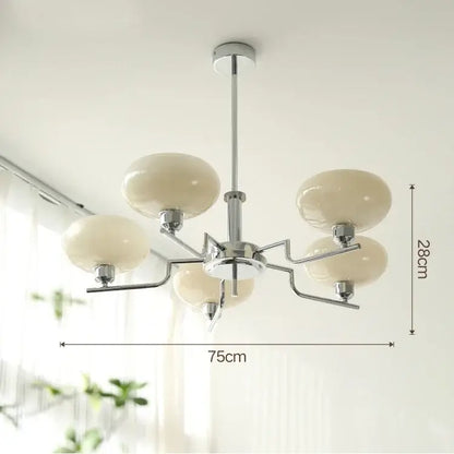 Modern chrome glass ball pendant chandelier with five cream-colored glass globe shades for bedroom decorbites glass ball