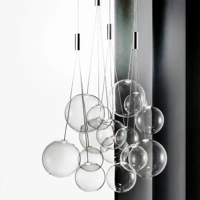 Modern chrome glass ball pendant light with clear spherical bulbs and thin metallic cords for dining room decorbites pendant light