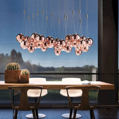 Modern rose gold spherical pendant light featuring decorbites glass ball orbs for dining room chandelier decor